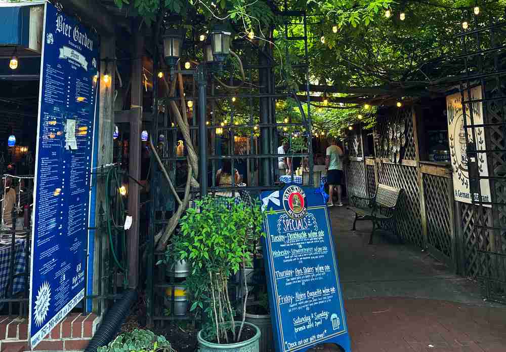 a photo of a beer garden with twinkly lights and trees in Portsmouth VA