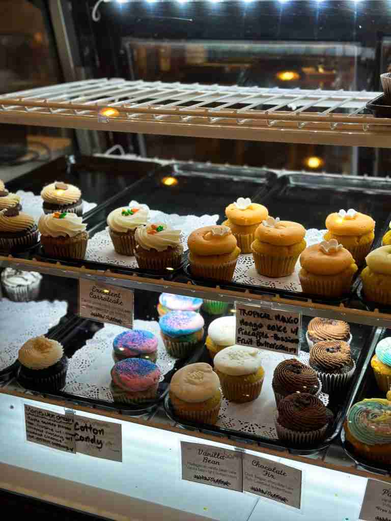 a display case full of cupcakes at a bakery in Portsmouth VA