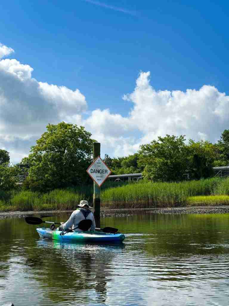 man kayaking at Paradise Creek Park in Portsmouth VA